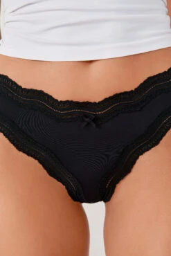 Eleganter Damen Tanga in Schwarz mit zarter Spitze und Mikrofaser -Etam Verkäufe 647464305 c